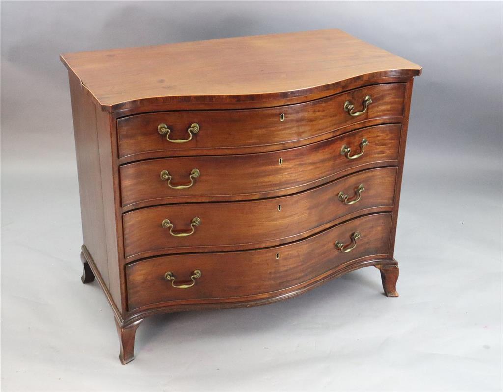 A George III serpentine mahogany dressing chest, W.3ft 6in. D.2ft 1in. H.2ft 10in.